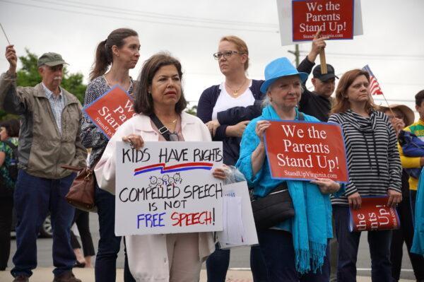 Parents protest Fairfax County Public Schools’ latest pro-transgender push in school policies outside of the county school board meeting in Falls Church, Va., on May 26, 2022. (Terri Wu/The Epoch Times)