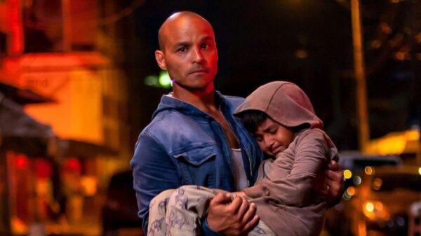 Omar (Jimmy Gonzales) and one of his orphans, in “Blue Miracle.” (Netflix)