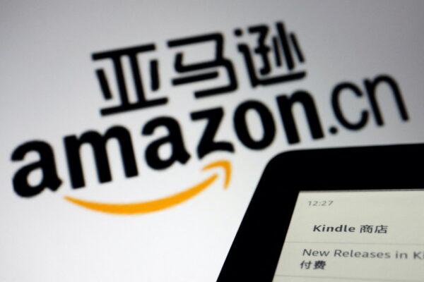 The sign of e-commerce website Amazon China next to a Kindle e-reader displayed in this illustration taken on Dec. 15, 2021. (Florence Lo/Reuters)