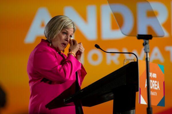 Ontario NDP Leader Andrea Horwath wipes away a tear as she announces her resignation as party leader during her campaign event in Hamilton on June 2, 2022. (The Canadian Press/Tara Walton)