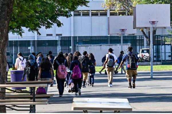 Students walk to their classrooms at a public middle school in Los Angeles, California, on Sept. 10, 2021. (Robyn Beck/AFP via Getty Images)