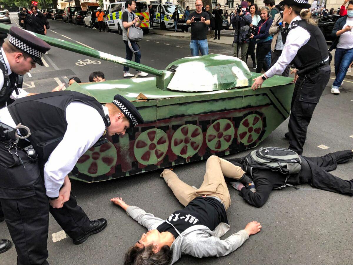British Police Stand in Way of Tank Symbolising Tiananmen Square Protests