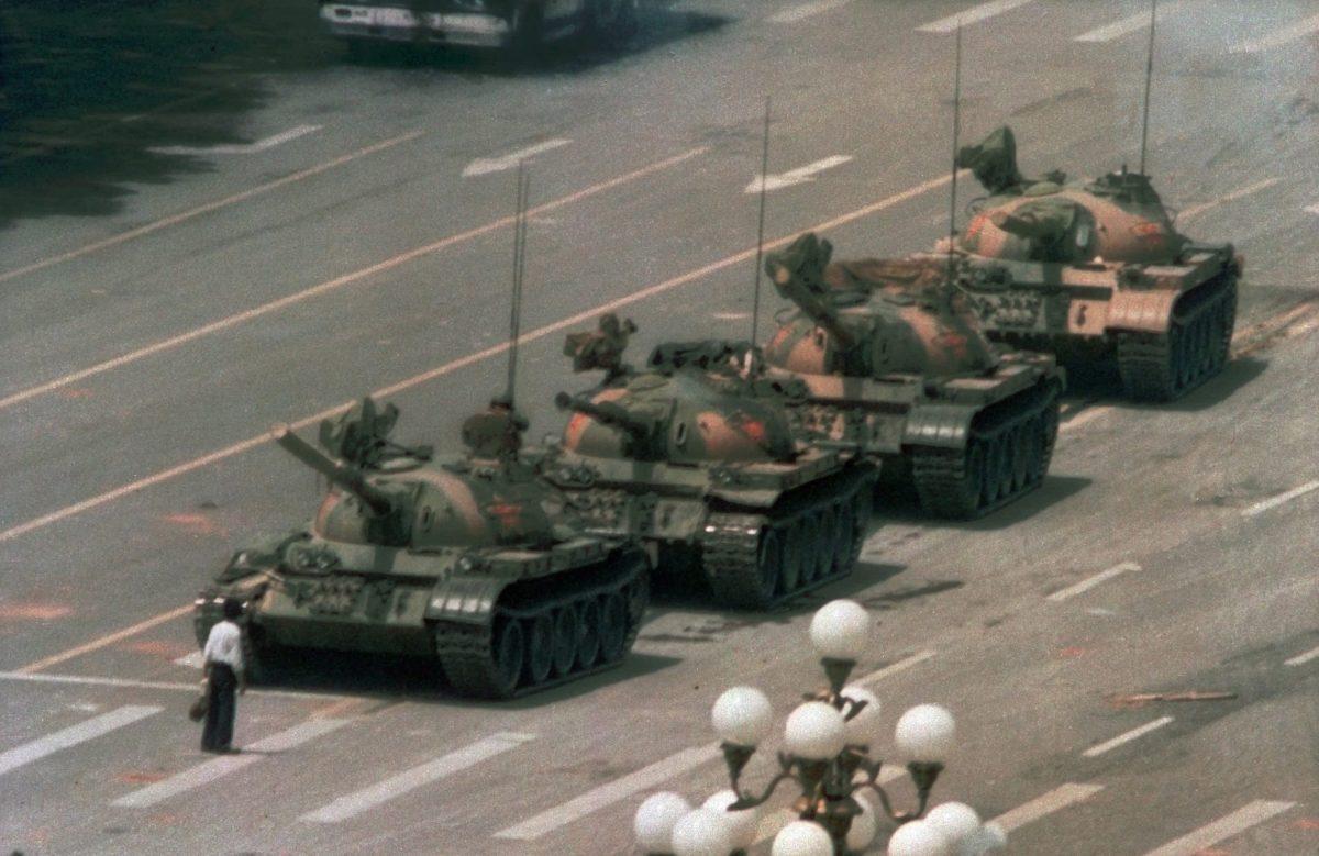 A Chinese man stands alone blocking a line of tanks heading east on the Avenue of Eternal Peace during the Tiananmen Square massacre, in Beijing on June 5, 1989. (Jeff Widener/AP Photo)