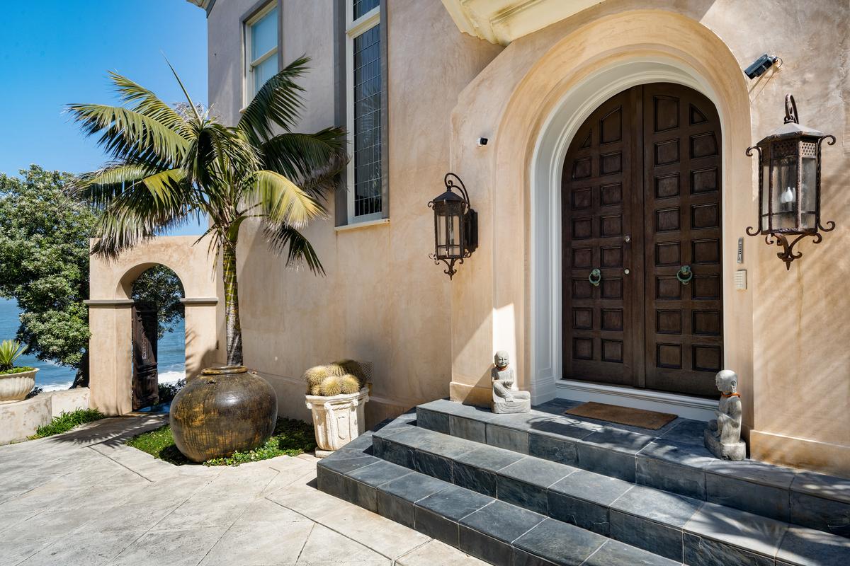 The home’s entrance exemplifies the overall grandiose flair of the home inside. Ultra-wide, towering doors are featured throughout the home. (Photos Courtesy of Brian Kitts/Neal Ward Properties)