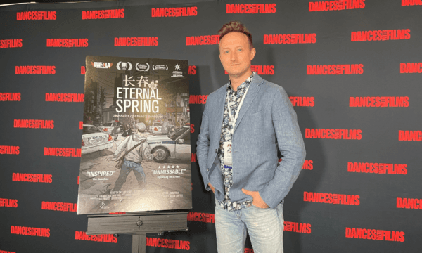 Jason Loftus, director of award-winning documentary "Eternal Spring" poses for photographs at the Southern California premiere of the film at Chinese Theatre in Hollywood, Los Angeles, on June 15, 2022. (Alice Sun/The Epoch Times)