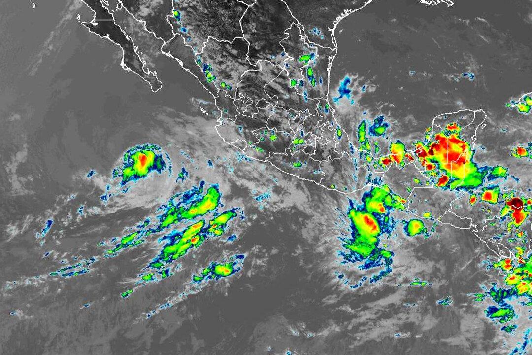Celia, Blas Weaken, but Still Bring Heavy Rain, Surf