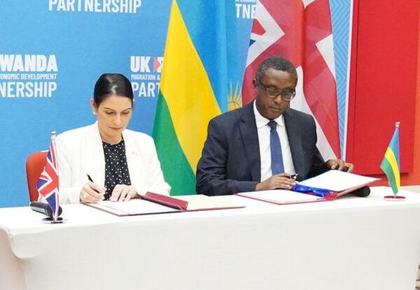 Undated image of then Home Secretary Priti Patel and then Rwandan Foreign Minister Vincent Biruta signing the migration and economic development partnership in Kigali on April 22, 2022. (Flora Thompson/PA)