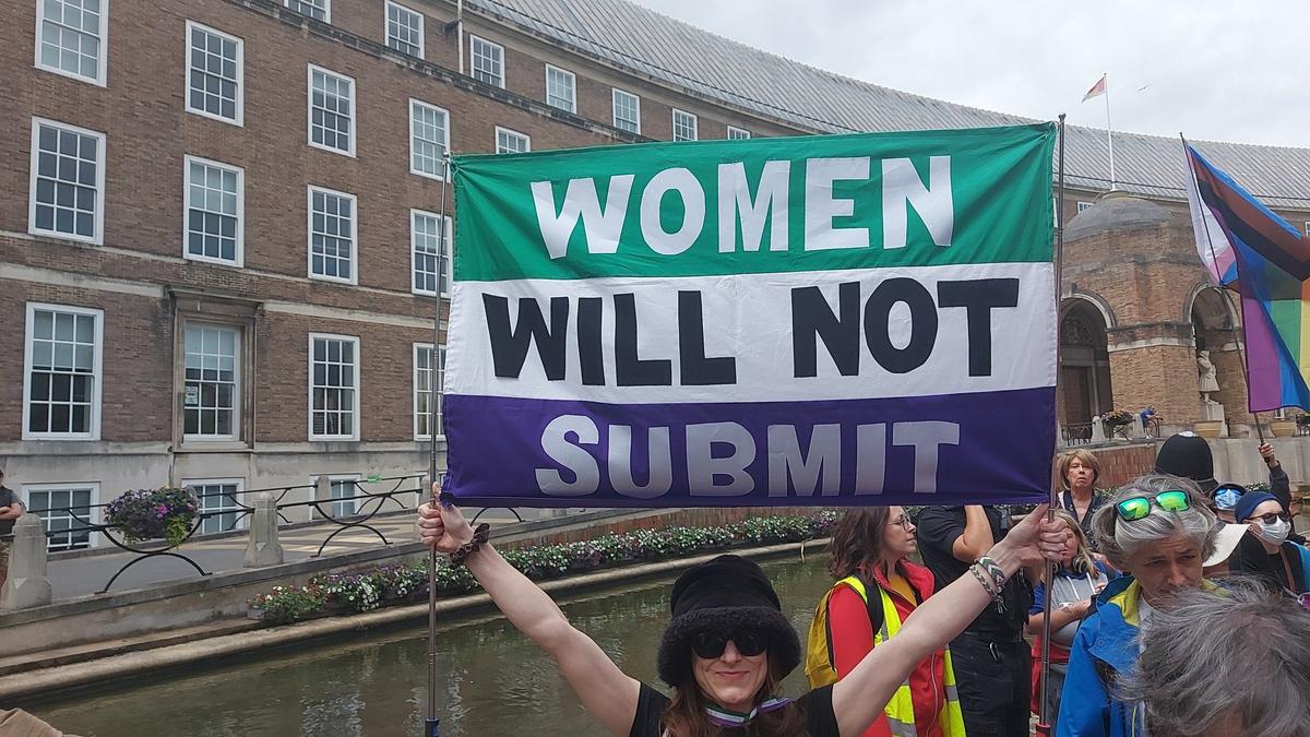 Balaclava-Clad Trans Activists Mob Women’s Group in England