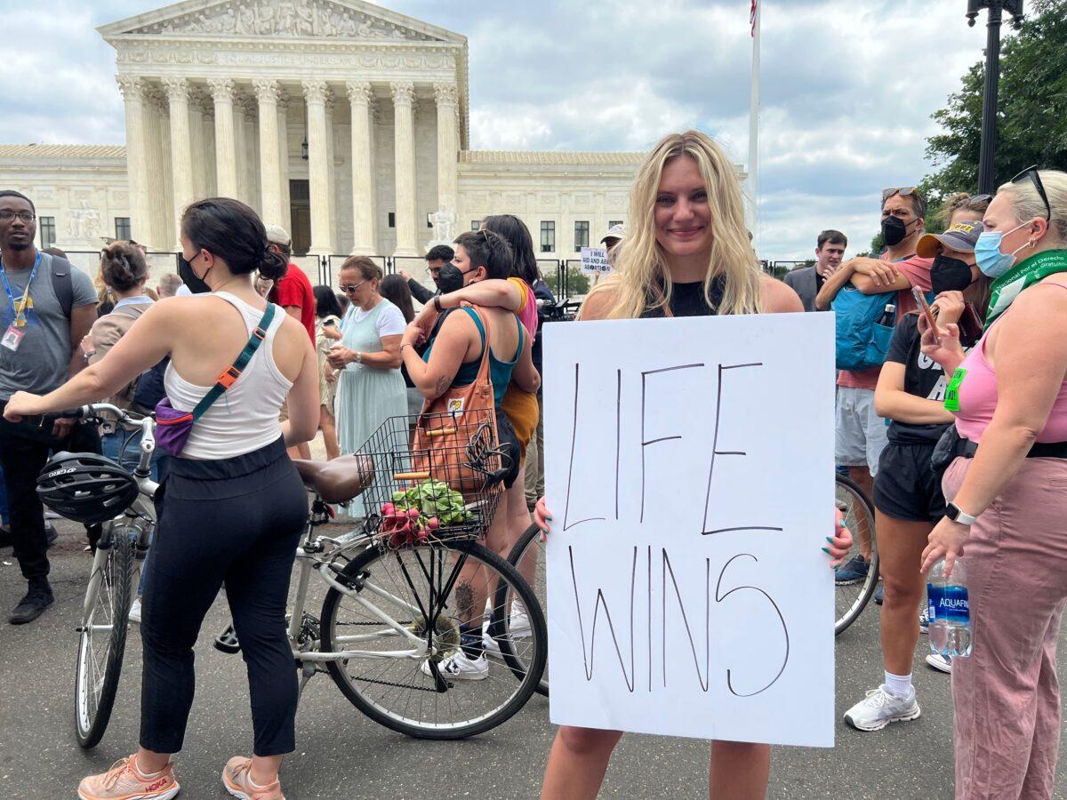 Pro-life supporter Anna Lulis outside the Supreme Court in Washington on June 24, 2022. (Emel Akan/The Epoch Times)
