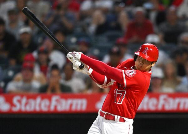 Shohei Ohtani #17 of the Los Angeles Angels hits a 3-run home run in the sixth inning of the game against the Kansas City Royals at Angel Stadium of Anaheim, in Anaheim, on June 21, 2022. (Jayne Kamin-Oncea/Getty Images)