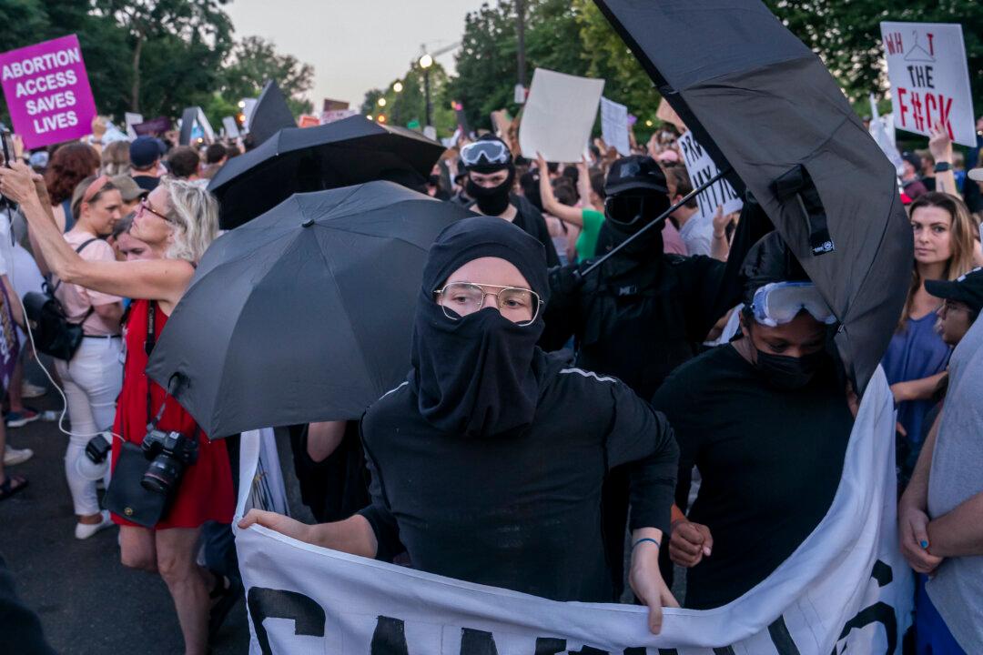 Pro-Abortion Activists Protest in Cities, Burn American Flag