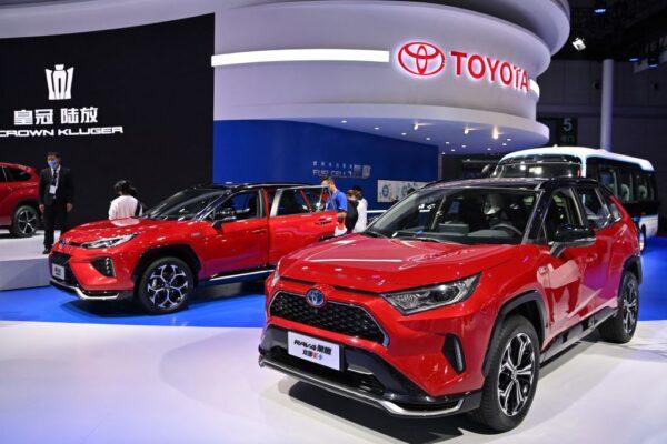 A Toyota Rav 4 Plug-in Hybrid (R) car at the 19th Shanghai International Automobile Industry Exhibition in Shanghai on April 19, 2021. (Photo by Hector RETAMAL / AFP) (Photo by HECTOR RETAMAL/AFP via Getty Images)