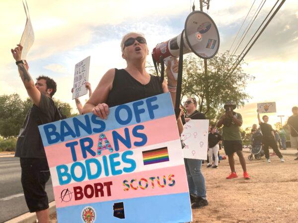 Another protester at a Women's March in Tucson, Ariz., shouts into a bullhorn in support of abortion rights on July 4, 2022. (Allan Stein/The Epoch Times)