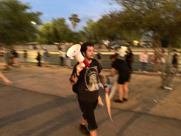A rally participant shouted at an Epoch Times reporter that he should leave the Women's March in Tucson, Ariz., on July 4, 2022. The protester also shouted, "My body, my choice." (Allan Stein/The Epoch Times)