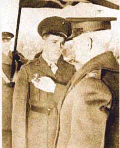An official photo of the ceremony held l at the Philadelphia Navy Yard on Feb. 18, 1943, in which Sergeant Albert Andrew Schmid received the Navy Cross. (Public Domain)