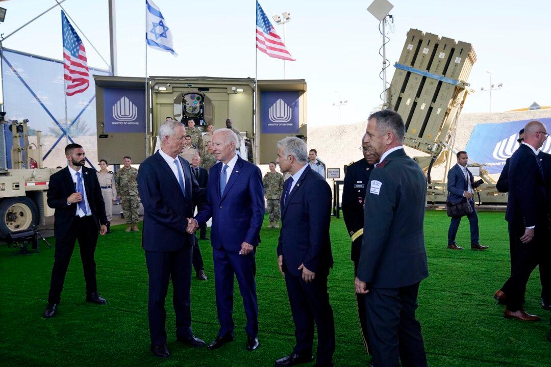 Biden Shakes Hands, Hugs Woman After White House Said He‘d ’Minimize Contact' in Israel