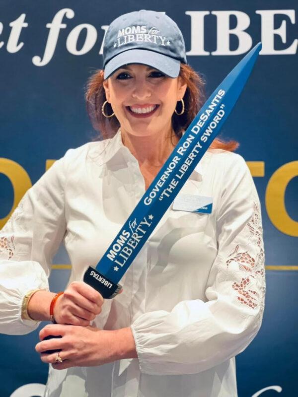 Tiffany Justice, co-founder of Moms for Liberty, helped present "The Liberty Sword" to Florida Gov. Ron DeSantis during the organization's Joyful Warriors National Summit in July 2022 in Tampa. (Courtesy of Moms for Liberty)