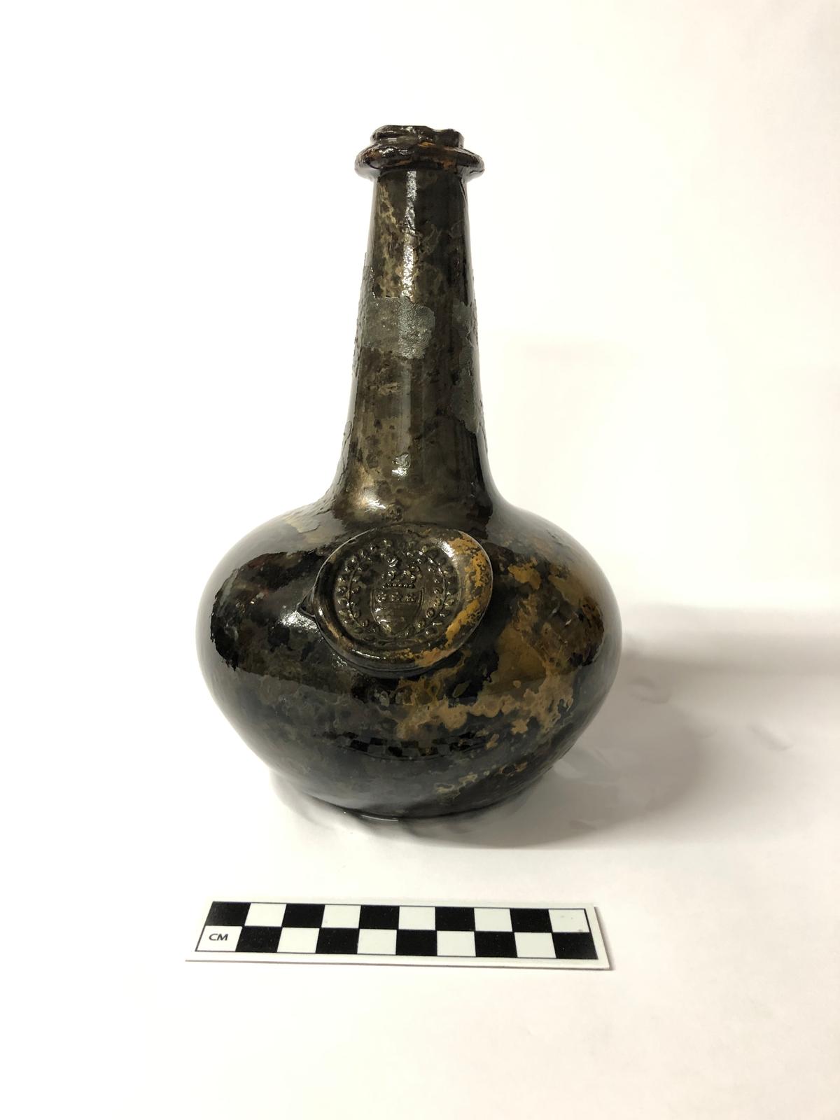 A wine bottle with the Washington family crest. (Courtesy of Norfolk Historic Shipwrecks)