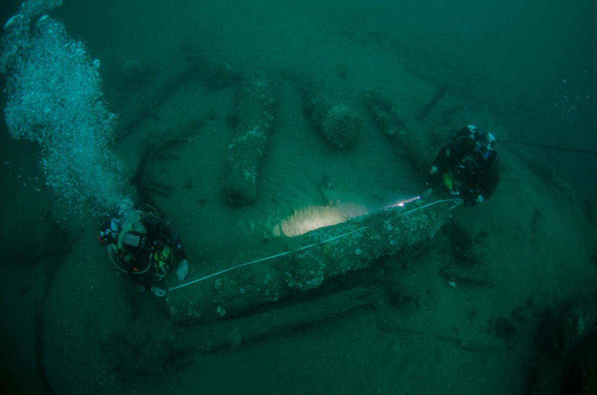 (L–R) Lincoln Barnwell and Julian Barnwell measuring cannons. (Courtesy of Norfolk Historic Shipwrecks)