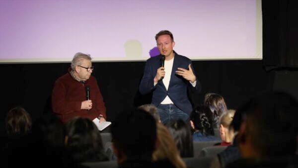 Peabody Award-winning filmmaker Jason Loftus, director of the new animated documentary “Eternal Spring,” speaks at a film screening in Melbourne, Australia, on July 20, 2022. (Grace Yu/The Epoch Times)