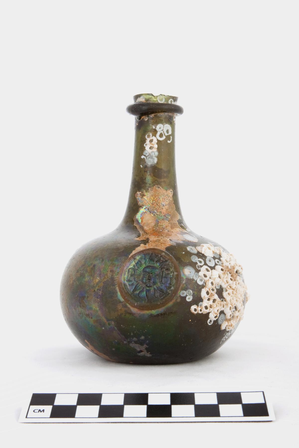Quarter size shaft and globe bottle with glass stamp. (Courtesy of Norfolk Historic Shipwrecks)