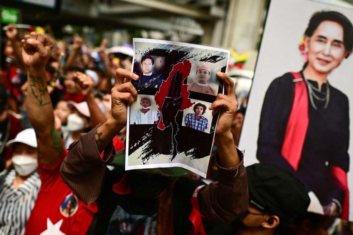 Protesters shout slogans and hold photos of executed prisoners during a demonstration against their killings by the military junta in Burma (also known as Myanmar), outside the Burmese embassy in Bangkok on July 26, 2022. (AFP via Getty Images/Manan Vatsyayana)