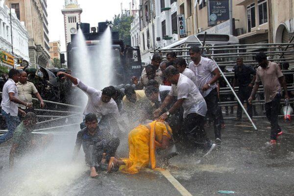 Police use water cannons to disperse farmers taking part in an anti-government protest demanding the resignation of Sri Lanka's President Gotabaya Rajapaksa over the country's economic crisis in Colombo, Sri Lanka, on July 6, 2022. (-/AFP via Getty Images)