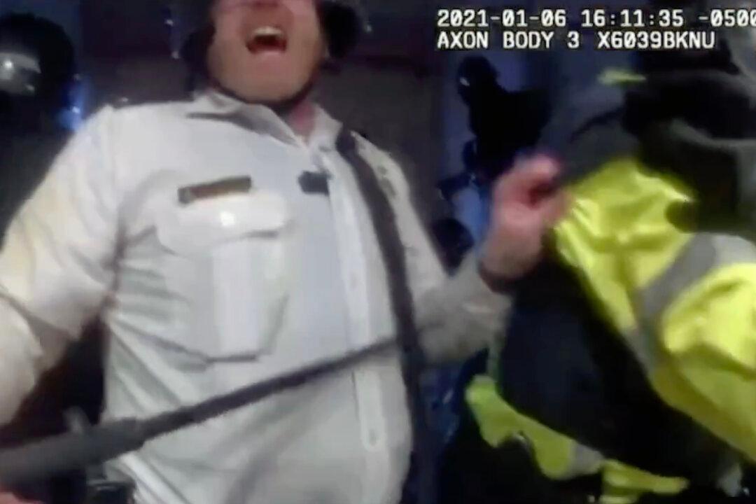 Prosecutors Identify Police Supervisor Who Beat Woman on Jan. 6