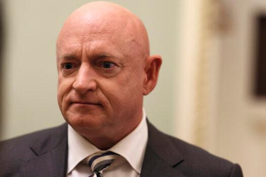 Sen. Mark Kelly (D-Arizona) speaks with a journalist before going to a luncheon with Senate Democrats in Washington, on June 14, 2022. (Anna Moneymaker/Getty Images)