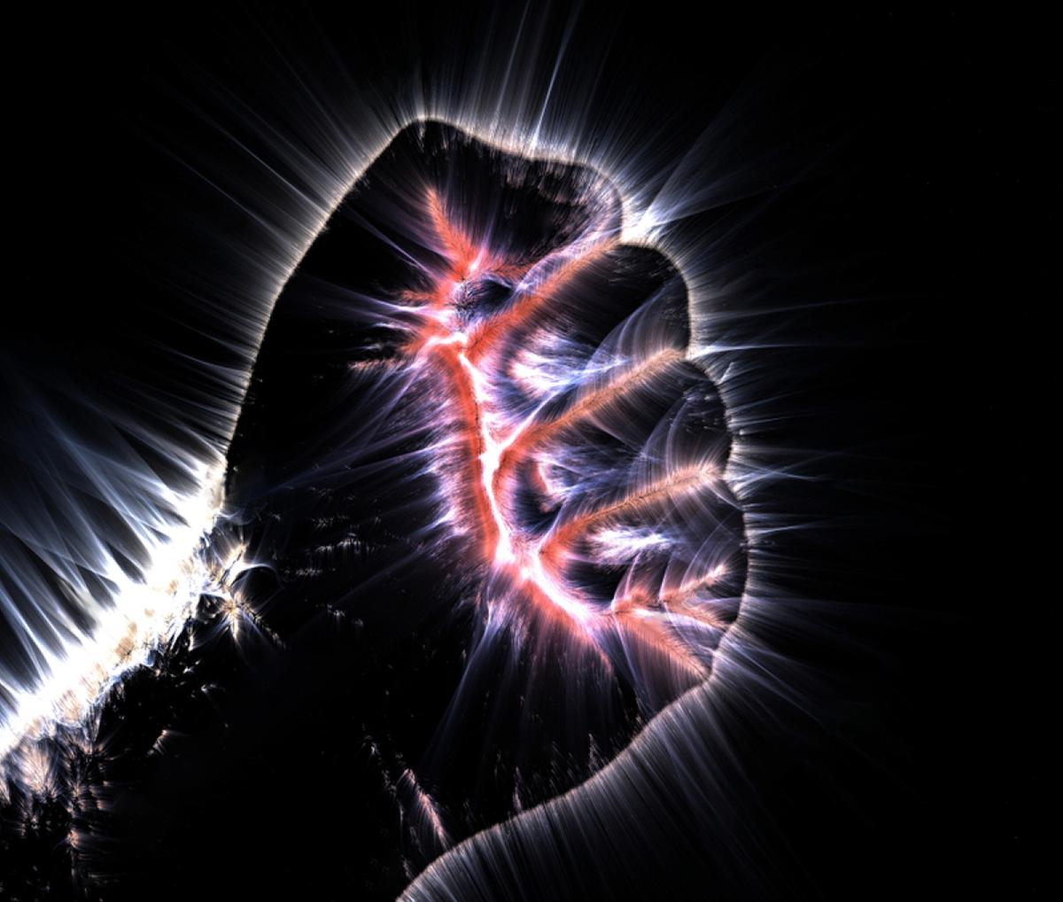 Kirlian aura photography shows a glowing human fist. (MP_Foto/Shutterstock)