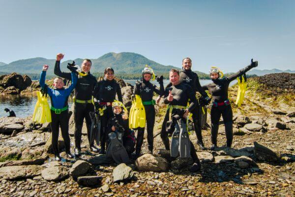 The generally calm waters at Mountain Point enable fun snorkeling activities. At left, a brief introduction to wetsuits and snorkel gear allows even first-timers to embrace venturing into the chilly waters. (Seanna O’Sullivan/ Ketchikan Visitors Bureau)