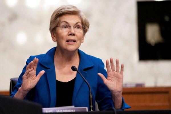 Sen. Elizabeth Warren (D-Mass.) gestures as Federal Reserve Chair Jerome Powell testifies before the Senate Banking, Housing, and Urban Affairs Committee on the "Semiannual Monetary Policy Report to the Congress" in Washington on June 22, 2022. (Elizabeth Frantz/Reuters)