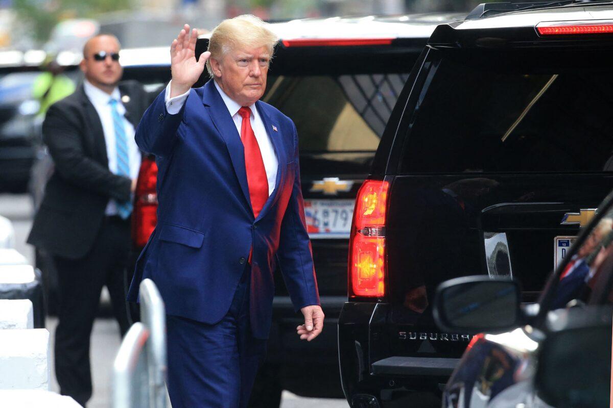 Former President Donald Trump waves while walking to a vehicle outside of Trump Tower in New York on Aug. 10, 2022. (Stringer/AFP via Getty Images)
