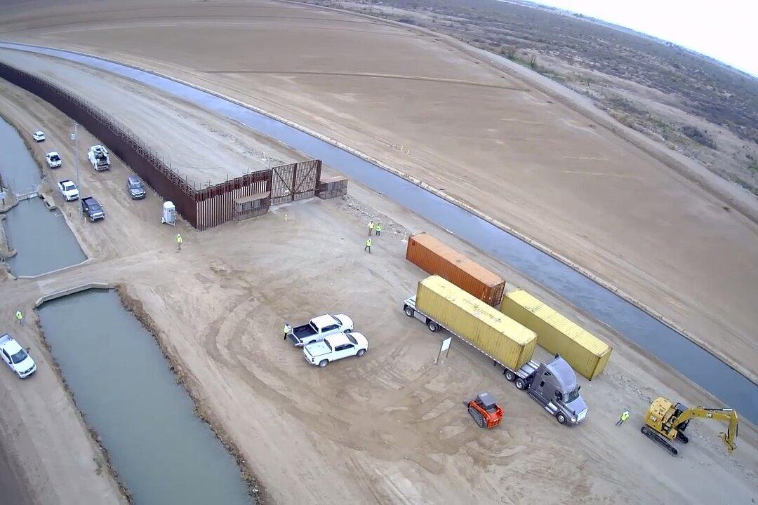 Biden Administration Tells Arizona Using Shipping Containers to Plug Gaps in Border Wall Is Illegal