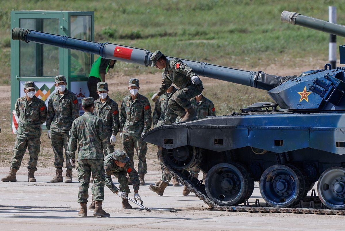 Chinese soldiers operate with their Type 96A tank during the Tank Biathlon competition at the International Army Games 2022 in Alabino outside Moscow, Russia, on Aug. 16, 2022. Moscow announced joint military exercises with China, India, Mongolia, Belarus, and Tajikistan. (Maxim Shemetov/Reuters)