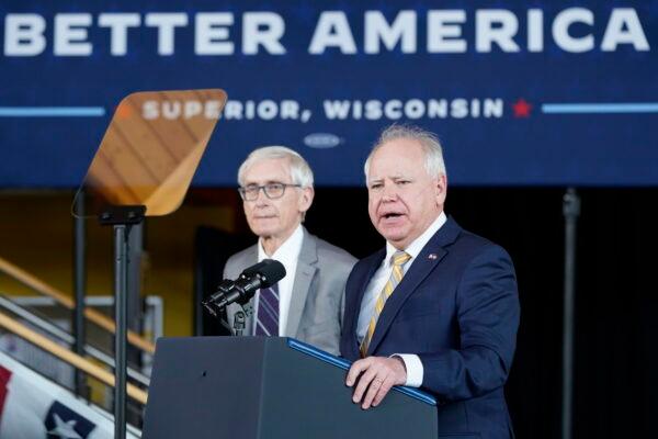 Minnesota Gov. Tim Walz speaks as Wisconsin Gov. Tony Evers listens before joining President Joe Biden for an event at the University of Wisconsin-Superior in March 2022. Both Democratic incumbents won reelections on Nov. 8. (Patrick Semansky/AP Photo)