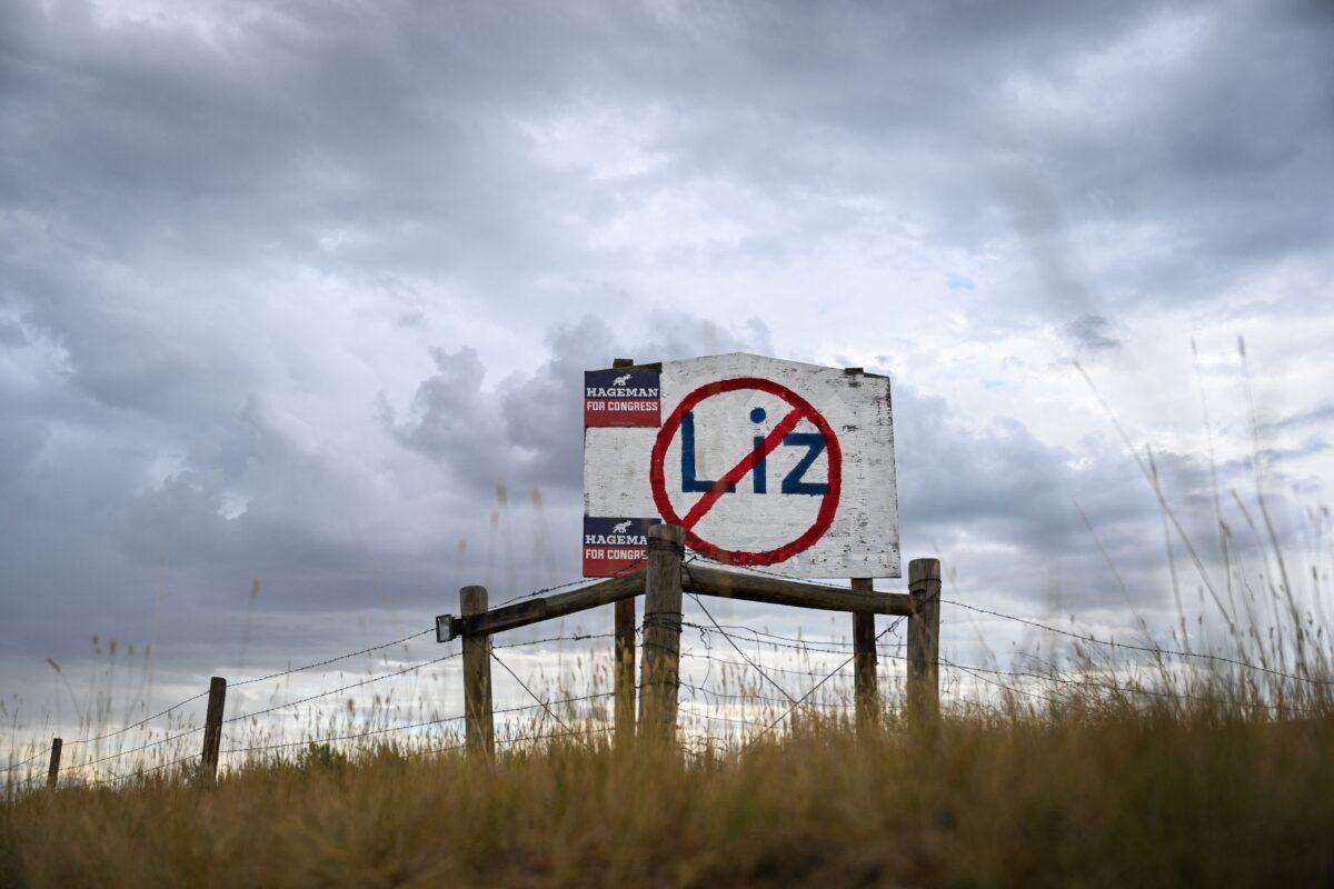 A hand-painted sign stands in opposition to Rep. Liz Cheney (R-Wyo.) displayed on the side of a road along with the support of her Republican primary opponent Harriet Hageman in Casper, Wyoming on Aug. 14, 2022. (Patrick T. Fallon/AFP via Getty Images)