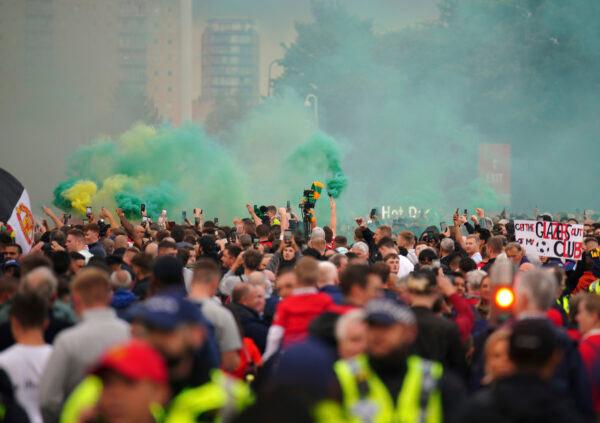 Fans gather to protest against the Manchester United owners outside the Old Trafford ground before the English Premier League match between Manchester United and Liverpool in Manchester, England, on Aug. 22, 2022. (Peter Byrne/PA via AP Photo)