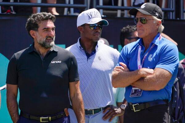 Yasir Al-Rumayyan (L), governor of Saudi Arabia's Public Investment Fund, Majed Al-Sorour (C), CEO of Golf Saudi, and Greg Norman, CEO of LIV Golf, watch at the first tee during the second round of the Bedminster Invitational LIV Golf tournament in Bedminster, N.J., on July 30, 2022. (Seth Wenig/Yasir Al-Rumayyan)