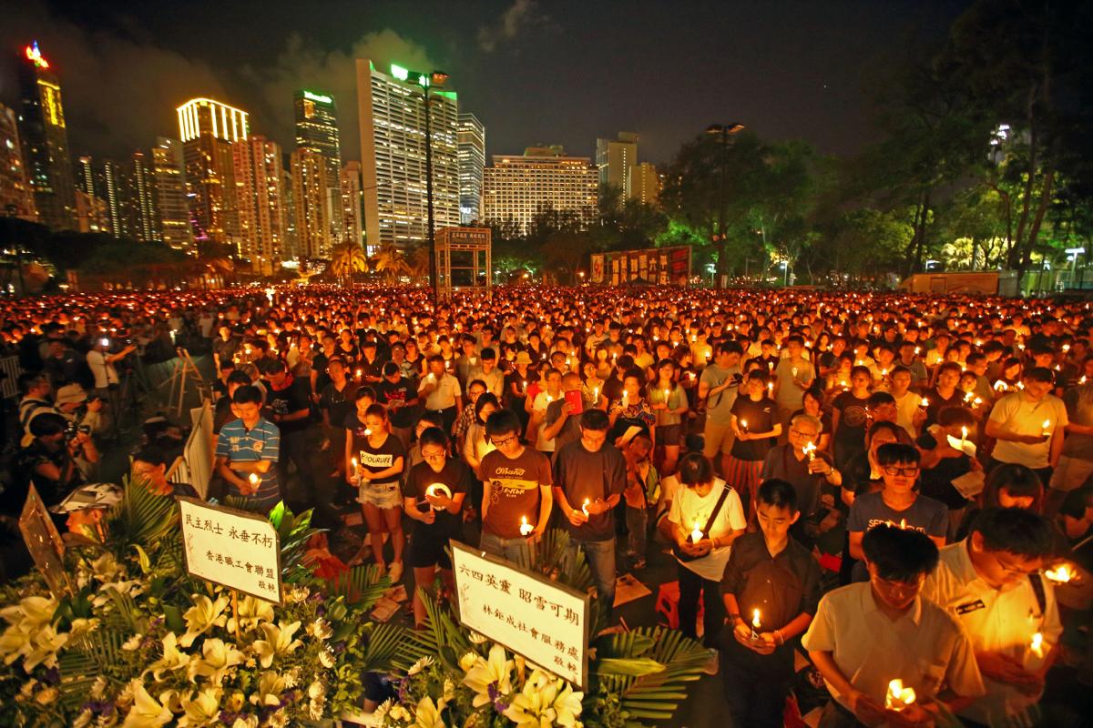 On the evening of June 4, 2014, 180,000 people observed a moment of silence at the June 4 candlelight vigil. From 1990 to 2019, such gatherings occurred in HK annually to commemorate June 4. (Tzoi-shu Poon/The Epoch Times)