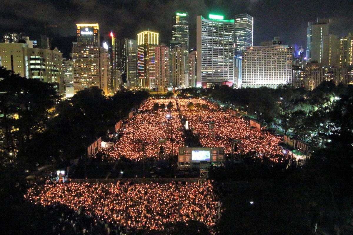 On the evening of June 4, 2014, the HKASPDMC held its annual candlelight vigil in Victoria Park, and called on the public to unite to rectify June 4 and end the CCP's one-party dictatorship. This was an annual event in HK since 2010 but was stopped after the CCP implemented the NSL in HK. (Kiri Tsoi/The Epoch Times)