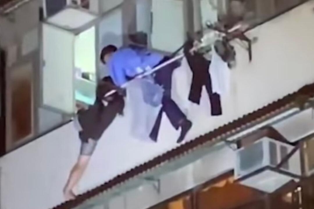 5-Year-Old Boy Found Unconscious in Subdivided Flat; Mother Attempted to Jump Off Building, Arrested for Murder