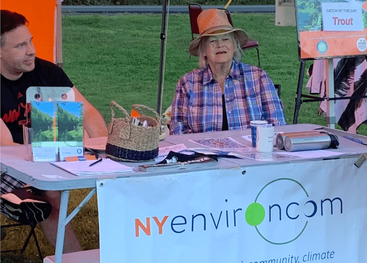 Alex Scilla (L), founder of New Paltz-based NYenvironcom, and Grace Woodard at the Mamakating Farmers Market in Wurtsboro, N.Y., on Sept. 2, 2022. (Epoch Times)