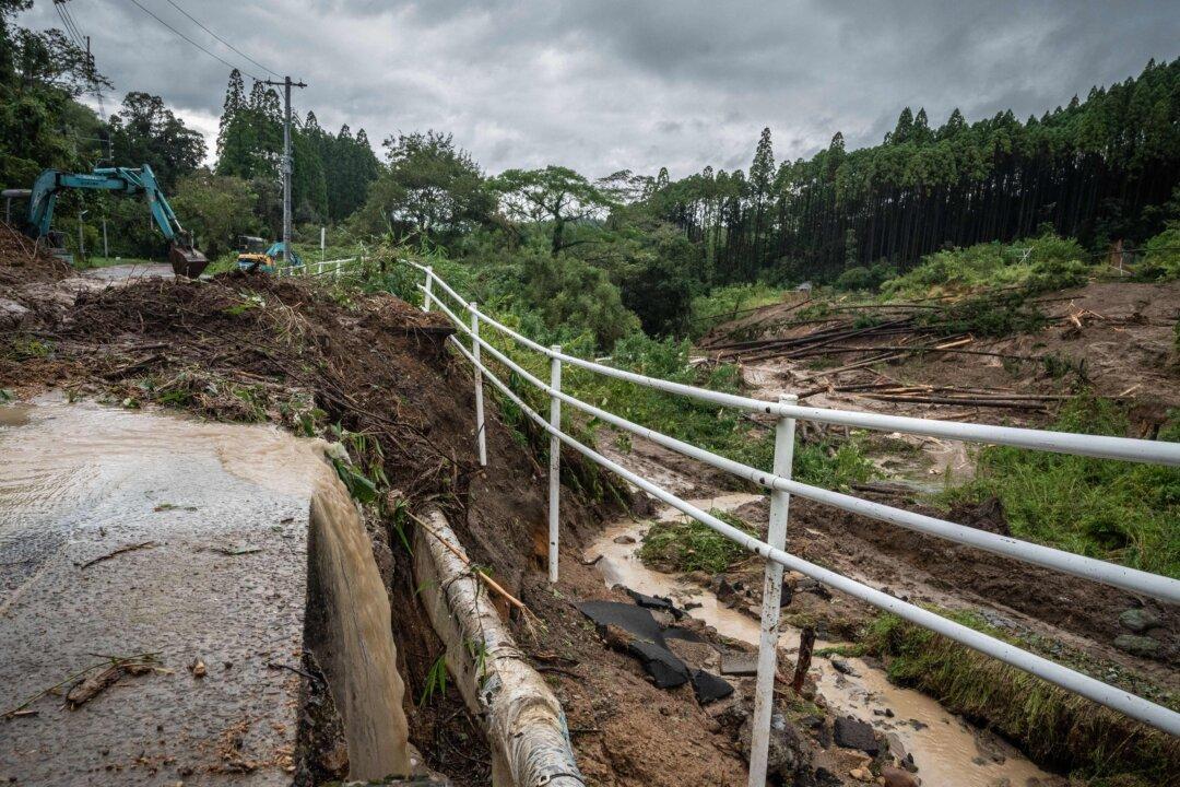 Typhoon Batters Western Japan With Record Rain, Killing 2