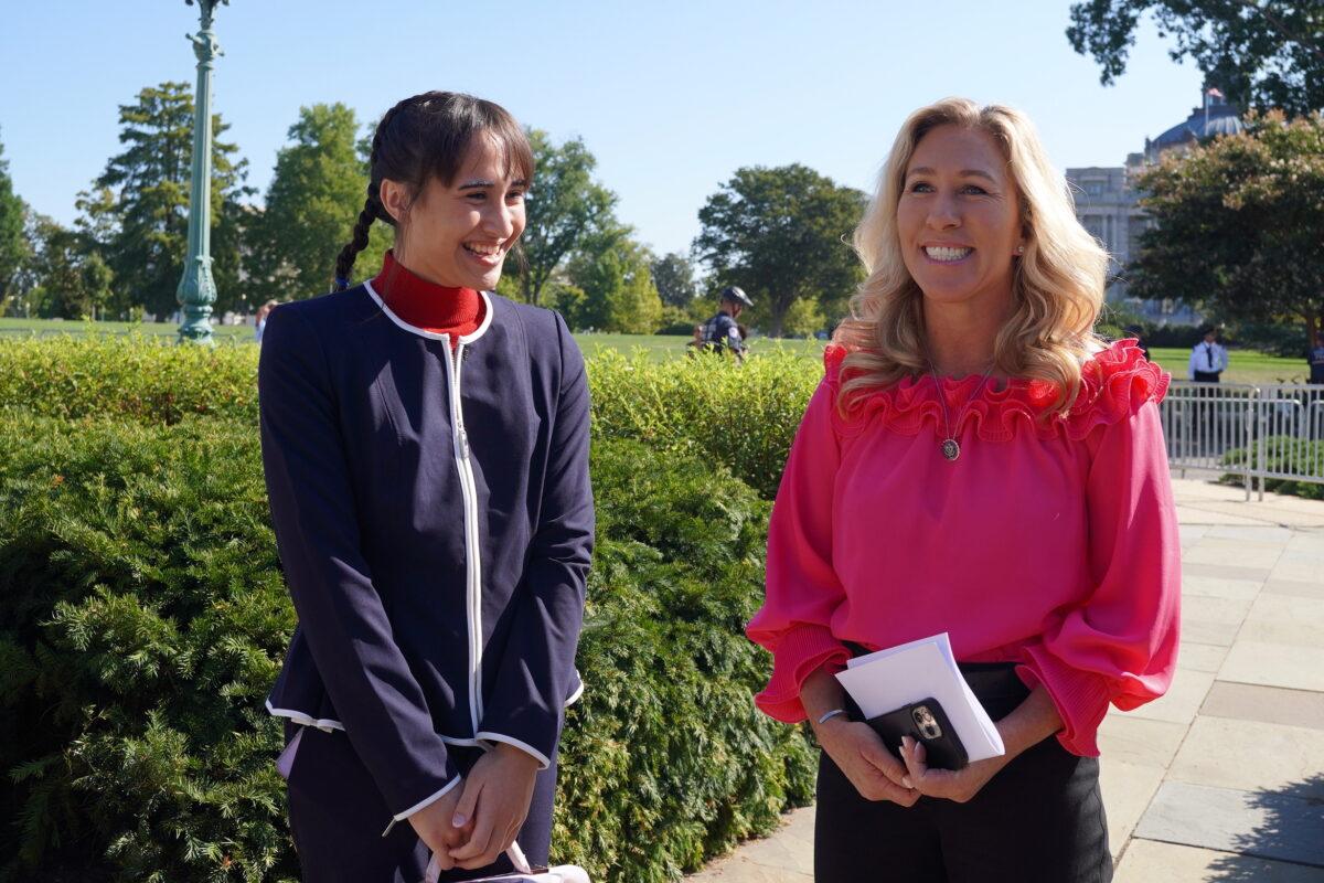 Chloe Cole, an ex-transgender teen, with Rep. Marjorie Taylor Greene (R-Ga.) outside the U.S. Capitol in Washington on Sept. 20, 2022. (Terri Wu/The Epoch Times)