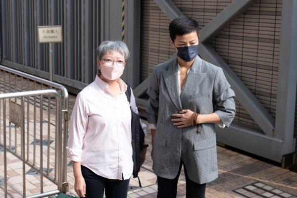 Cyd Ho (L), former lawmaker and former member of legislative council, and Hong Kong singer and activist Denise Ho arrive at the West Kowloon Magistrates' courts in Hong Kong on Sept. 26, 2022. (Oiyan Chan/AP Photo)