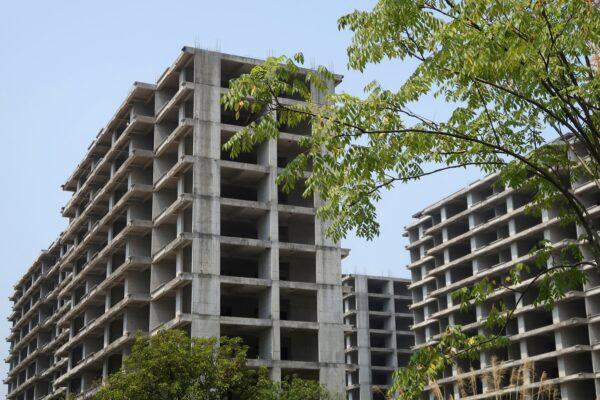 Unfinished apartment buildings stand at a residential complex developed by Jiadengbao Real Estate in Guilin, Guangxi Zhuang region of China, on Sept. 17, 2022. (Eduardo Baptista/Reuters)