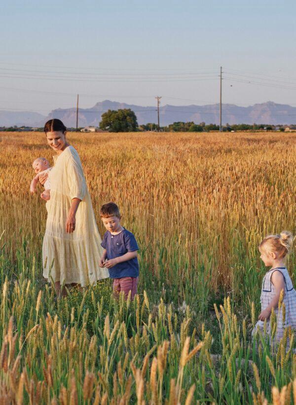 Emma Zimmerman, co-founder of Hayden Flour Mills, mainly handles the business side of the company, but she still makes time to check on the wheat fields and talk with the farmers— sometimes with her family in tow. (David Alvarado)