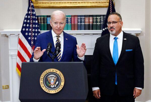 President Joe Biden announces student loan relief with Education Secretary Miguel Cardona (R) at the White House in Washington, on Aug. 24, 2022. (Olivier Douliery/AFP via Getty Images)