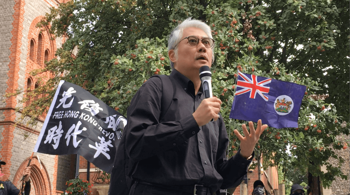 Benson Wong, a scholar of Hong Kong cultural studies and politics, delivered a speech at the rally in Reading, on Oct 1, 2022. (Shan Lam/The Epoch Times).